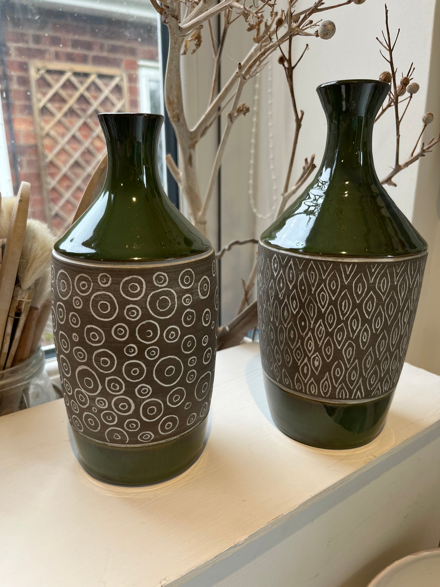 Green carved stoneware narrow necked vase