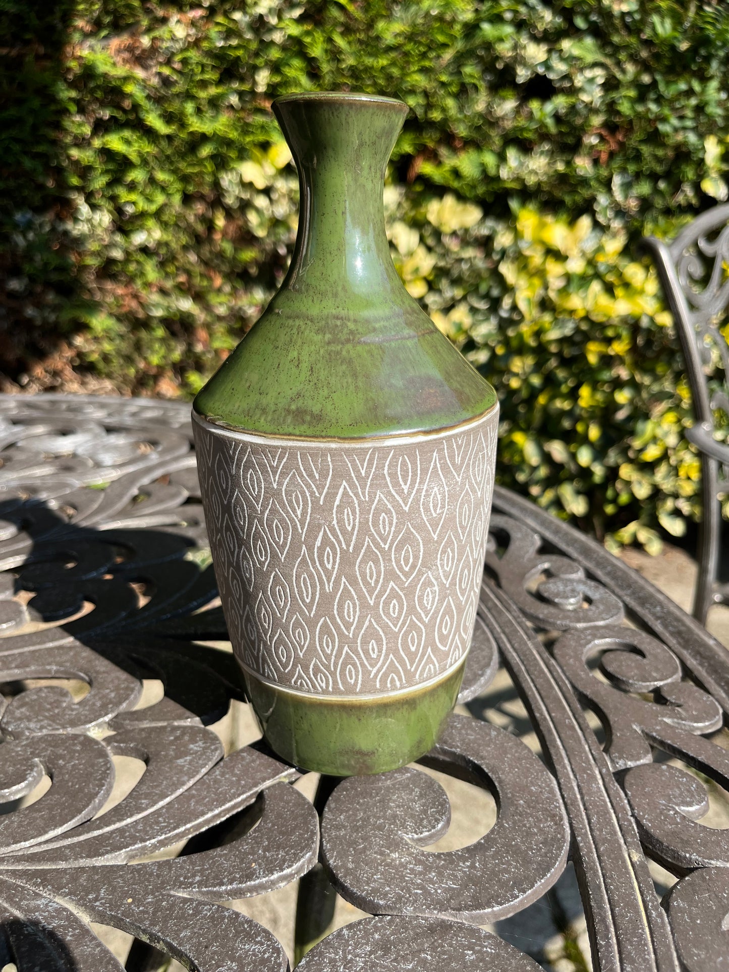 Green carved stoneware narrow necked vase