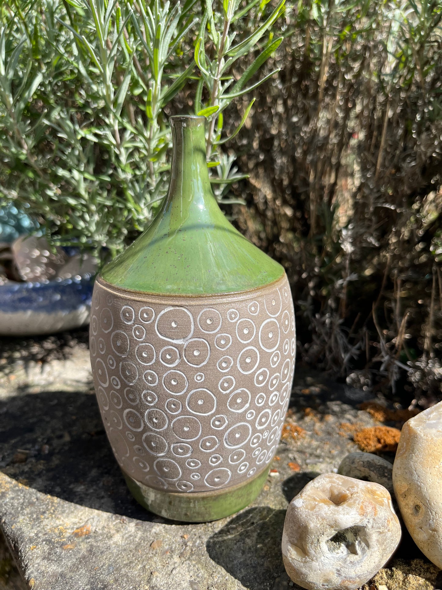 Carved pottery green narrow-necked bottle